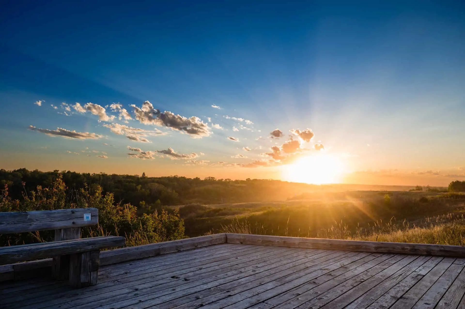 Golden hour landscape at Beaver Creek Conservation Area with prairie hills and open sky.