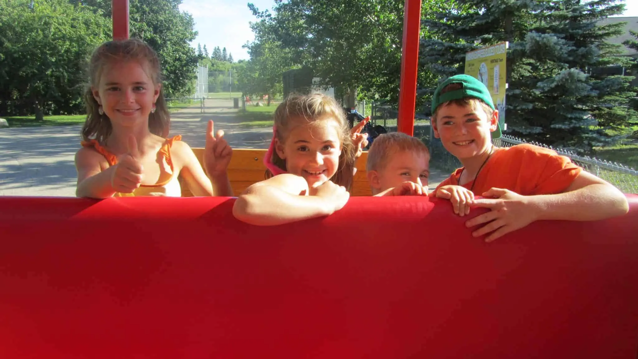 Kids enjoying the miniature train ride at Saskatoon Forestry Farm Park and Zoo.