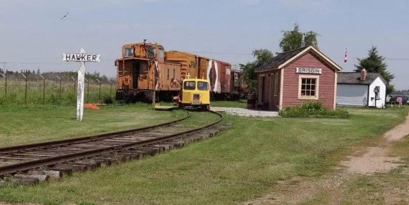 Vintage rail cars and station buildings at the Saskatchewan Railway Museum, part of the Eaton Internment Camp site near Saskatoon.
