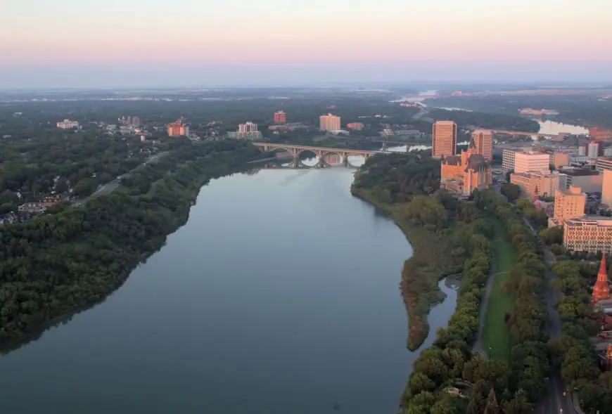 Aerial view of the South Saskatchewan River winding through downtown Saskatoon.