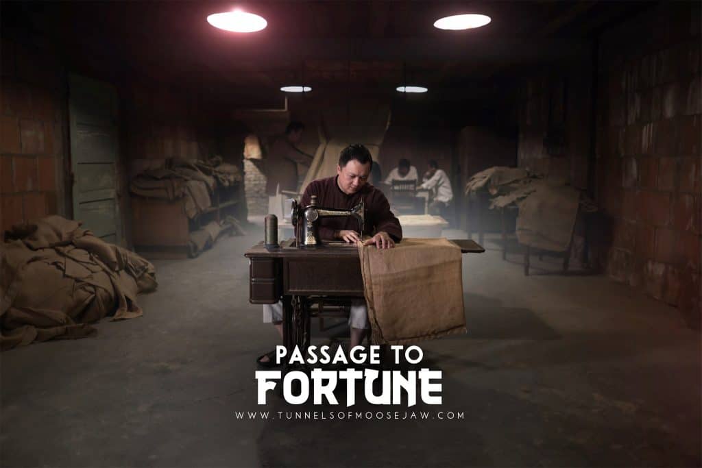 The Tunnels of Moose Jaw Man sitting at a sewing machine, sewing burlap sacks with text that says Passage to Fortune- one of the tunnels at the Tunnels of Moose Jaw