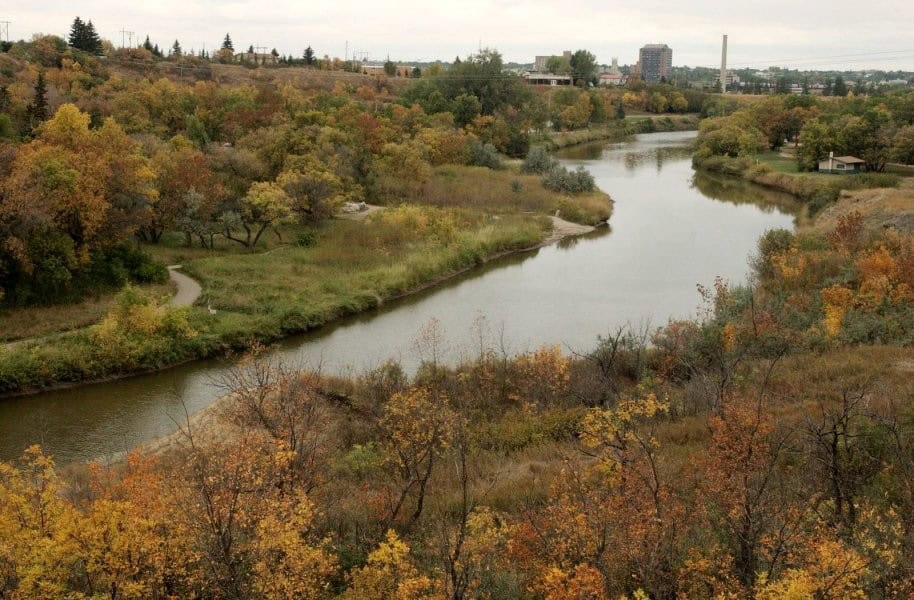Moose Jaw on a Budget aerial view of winding river through Wakamow Valley with fall folage