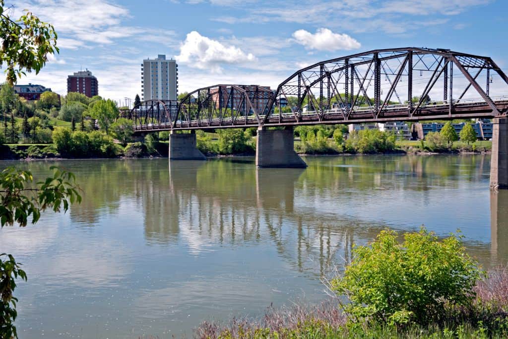 free things to do in Saskatoon Victoria Bridge over Saskatchewan River with city skyline in background