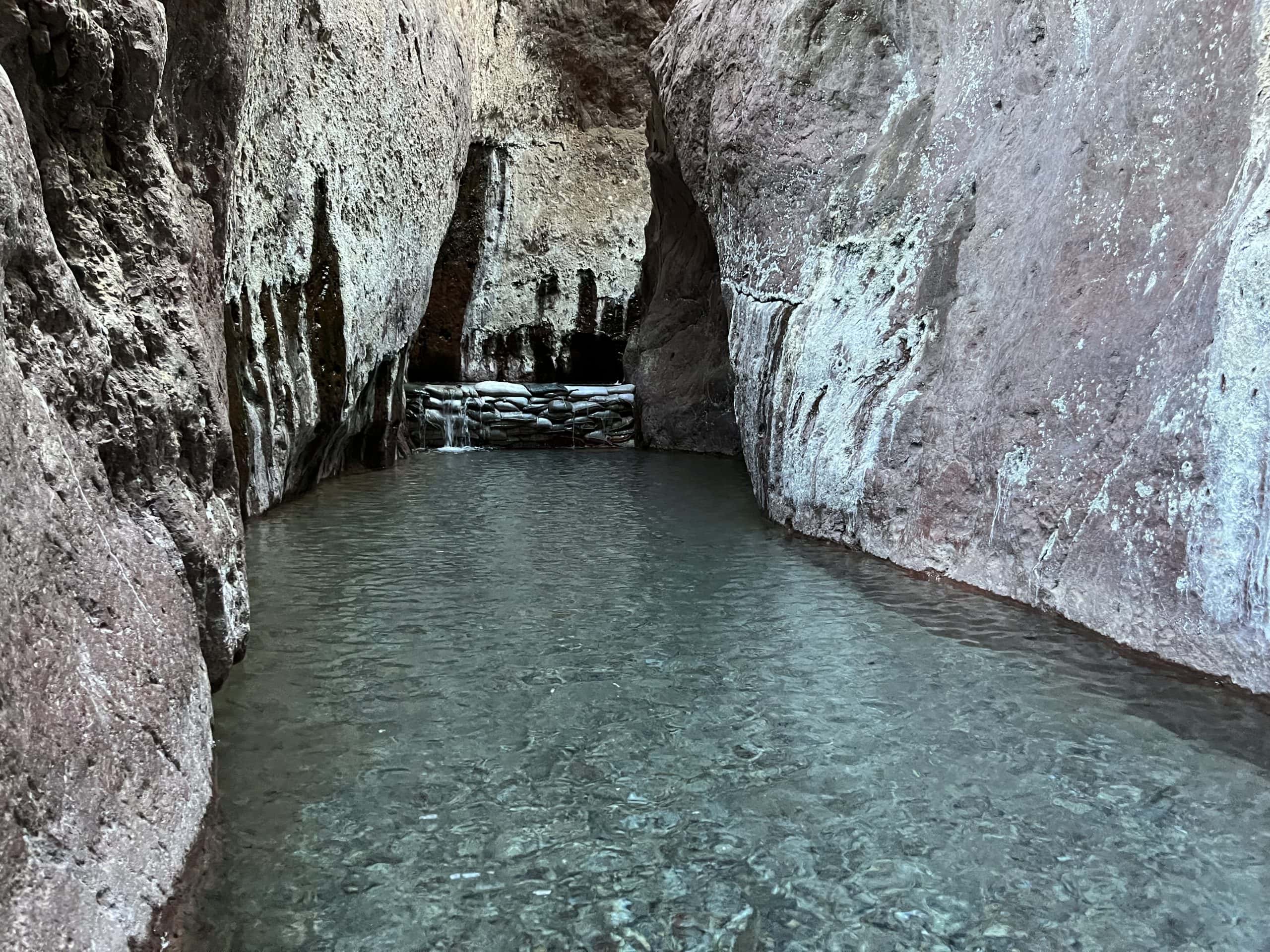 Black Canyon self guided trip Black Canyon hot pool surrounded by canyon walls at Arizona Hot Springs