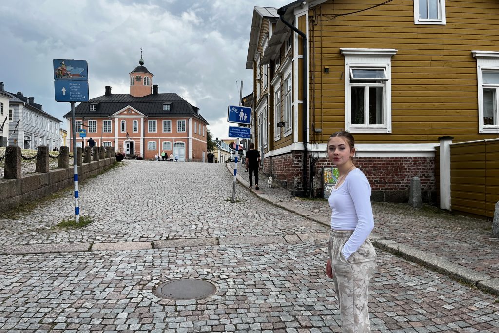 Sarah standing on a cobblestone street in Old Porvoo