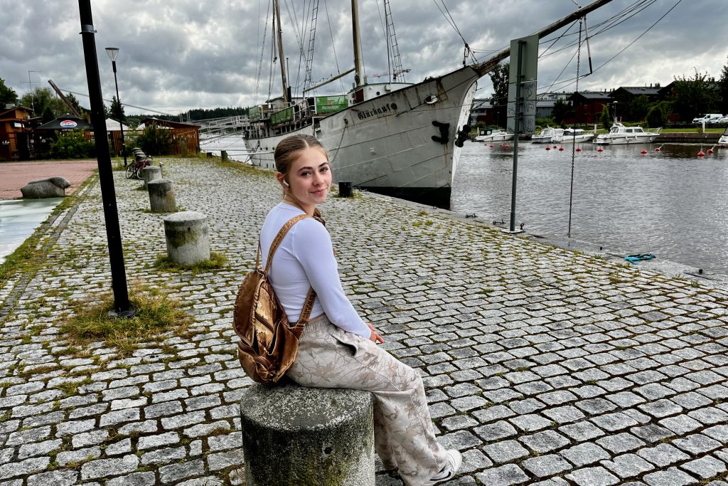 Sarah relaxing beside the river at the Porvoo Harbour
