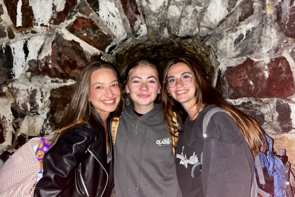Jaimie, Sarah, and Lidia at the end of a tunnel in one of the historic buildings.