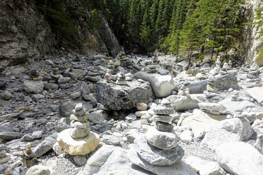 Off the beaten path Kananaskis hikes Inukshuks stacked in a bolder field in Grotto Canyon