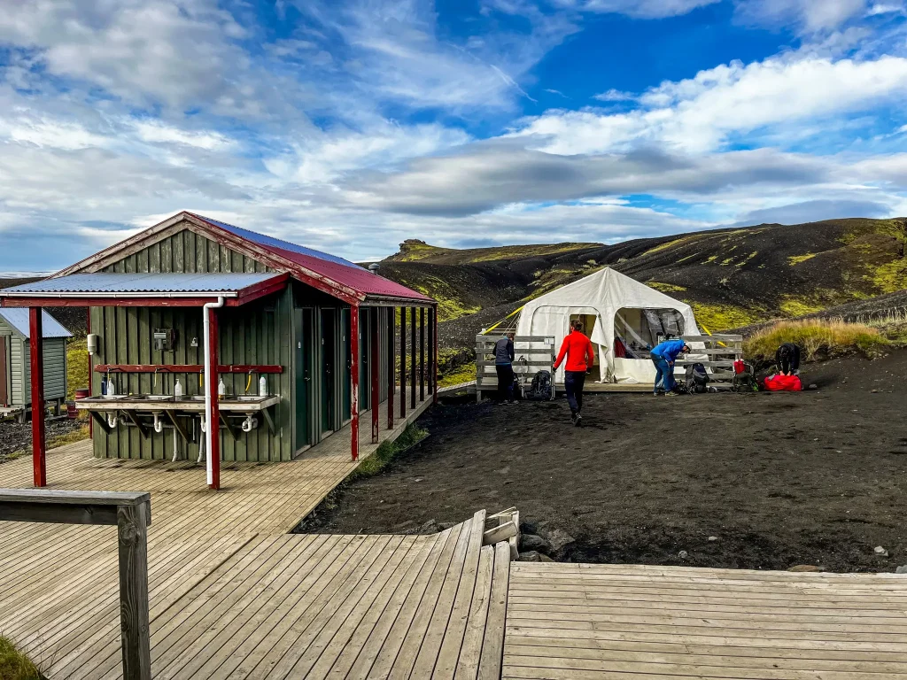 Bathroom facilities and shared cooking tent at the Emstrur hut area, used by hikers camping on the Laugavegur.