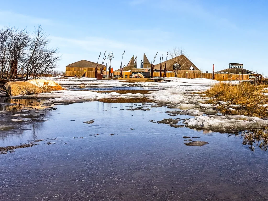 Spring puddles and melting snow at Wanuskewin Cultural Centre near Saskatoon