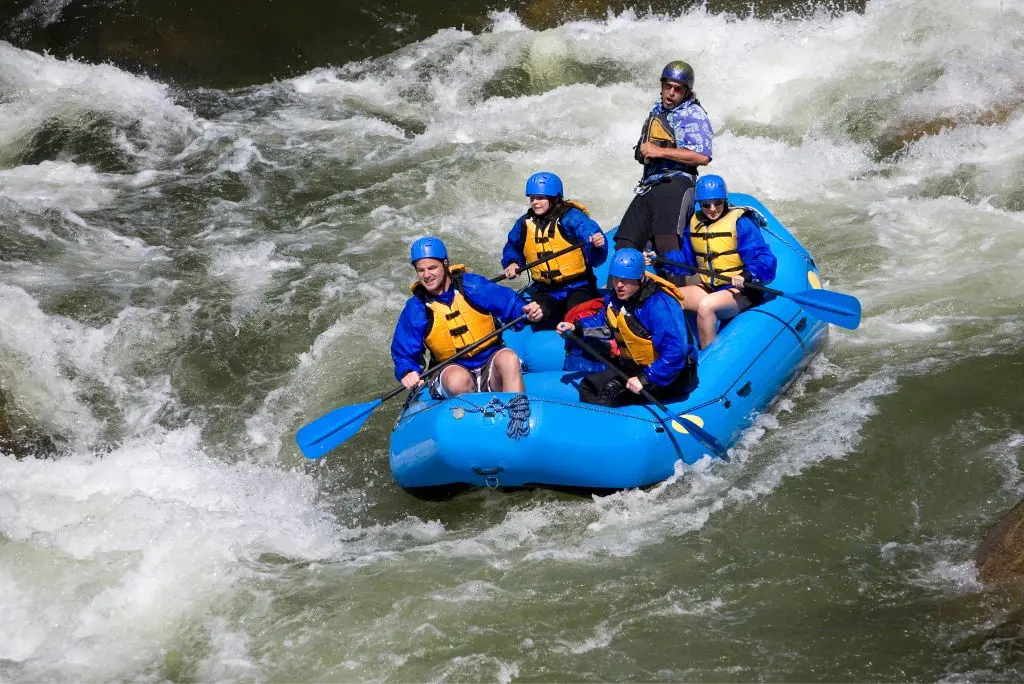Raft navigating white water rapids on the Kananaskis River